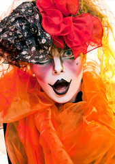 woman mime with a red bow, close-up portrait