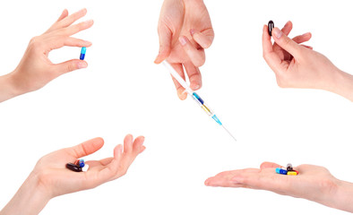 hand of a woman holding a pills and syringe, isolated