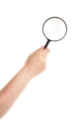 Obraz na płótnie Canvas Hand holding magnifying glass