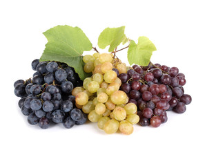Three fresh grapes with leaves isolated on white