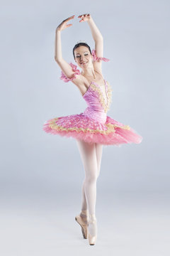 Full length of young ballet dancer, wearing tutu