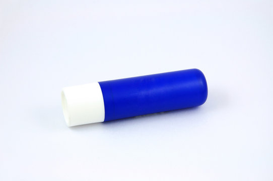 Blue tube of lip balm isolated on white background Photos | Adobe Stock