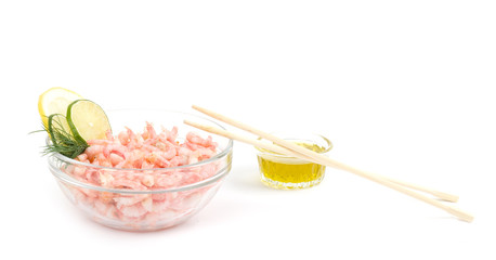 Tasty boiled shrimps on plate and chopsticks on white background