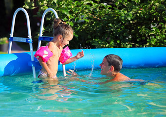 Kids having fun in the swimming pool