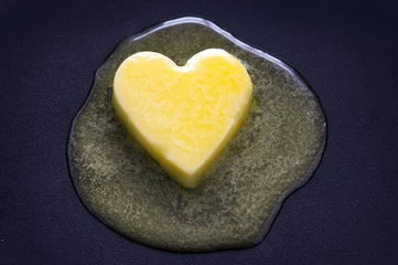 Foto op Plexiglas butter heart melting © eelnosiva