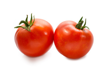 two Red tomatoes on white background