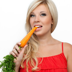 girl eating vitamin rich carrot