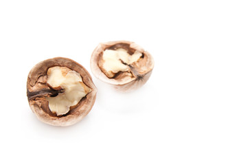 walnut and a cracked walnut isolated on the white background