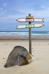Obraz premium Double directional signs on a beach 2012 to 2013