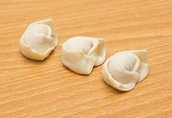 homemade meat dumplings on a cutting board