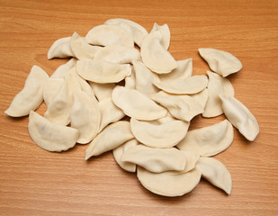 homemade meat dumplings on a cutting board