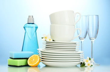 empty clean plates, glasses and cups with dishwashing liquid,