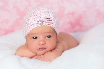 Newborn Baby Girl Wearing a Pink Flapper Style Hat