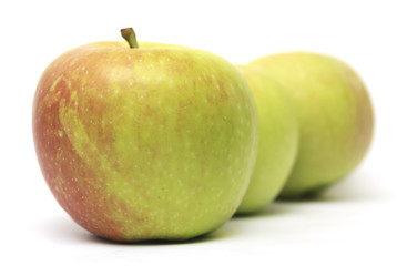 row of three apples
