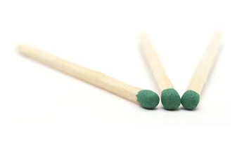 three green match on a white background