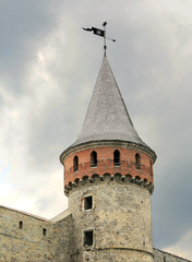 Tower on cloudy sky background