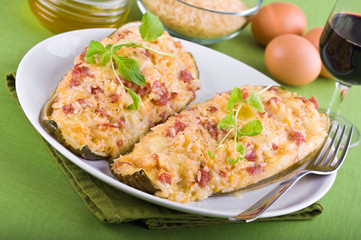 Stuffed zucchini halves.