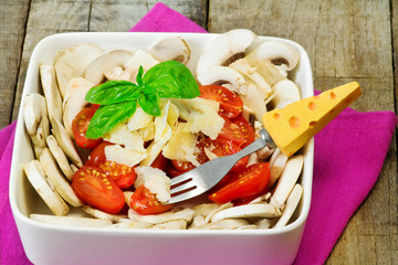 healthy salad with parmesan cheese, mushrooms and tomatoes