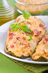 Stuffed zucchini halves.
