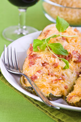 Stuffed zucchini halves.