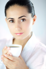 Beautiful Young Woman With White Cup of Coffee