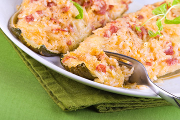 Stuffed zucchini halves.