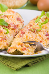 Stuffed zucchini halves.