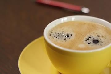 Yellow cup of coffee