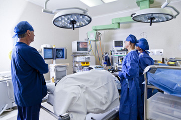 Surgery room with surgeon and nurses