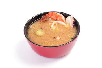 Soup. Miso soup with seafood. On a white background. Tiger shrim