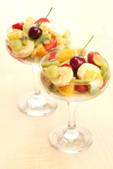 Fresh fruits salad on wooden table