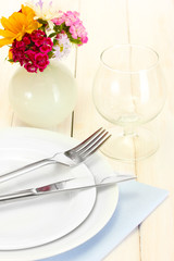 beautiful holiday table setting with flowers