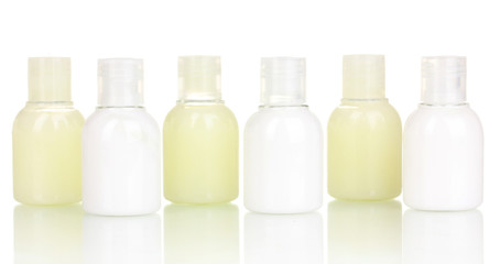 Hotel cosmetic bottles isolated on white