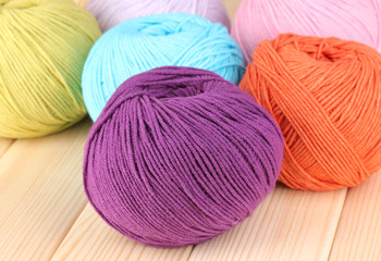 Knitting yarn on wooden background