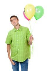 Happy elderly man with colorful balloons celebrating his birthda