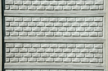 fence from a gray brick