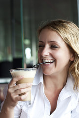 Beautiful woman in street cafe ,with cup