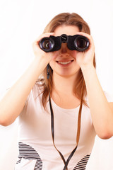 Attractive young girl looking through binoculars