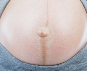 Pregnant woman with her belly