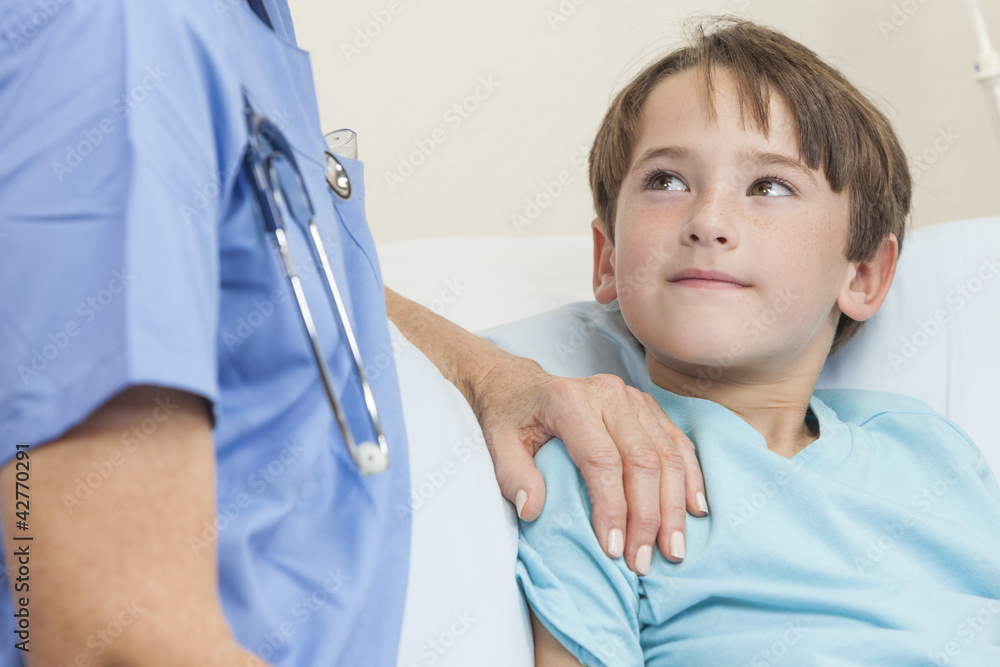 Wall mural Doctor or Nurse Comforting Young Boy Child Patient