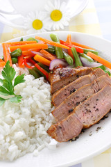 Rice with pork meat and vegetables