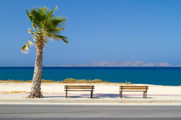 Benches at Aegean sea on Crete, Greece