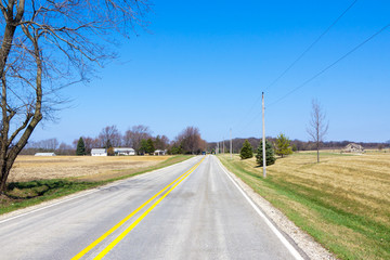 Fototapeta premium American Country Road With Blue Sky
