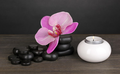 Obraz na płótnie Canvas Spa stones with orchid flower and candle