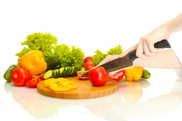 woman hands cutting vegetables on kitchen blackboard