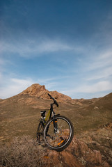 Fototapeta na wymiar Mountain bicycle amongst hills