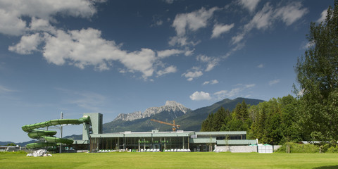 swim bath with outdoor pool and water slide at summer day
