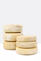 Fototapeta na wymiar various forms of cheese on white table