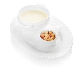 A bowl of creamy vegetable soup isolated