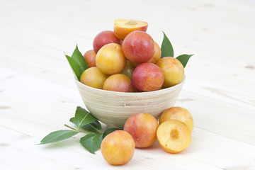 fresh plums in a bowl